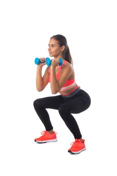 Healthy hispanic fitness girl with doing workout squat exercise isolated on white background