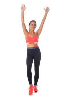 Healthy hispanic fitness girl with arms raised working out isolated on white background