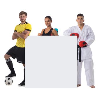 Group of sports people presenting empty banner with copy space for text isolated on white background