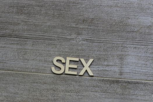 the word sex wrote out on a tile background. High quality photo