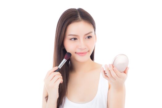 Beauty of portrait asian woman applying make up with brush of cheek isolated on white background, beautiful of girl holding blusher, skincare and cosmetic concept.