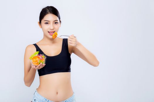 Beautiful portrait young asian woman smiling holding salad vegetable food isolated on white background, girl diet eating vegetarian for healthy, health care or wellness concept.