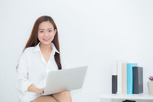 Beautiful young asian woman using laptop for leisure on sofa, girl working online with notebook freelance, communication business concept.