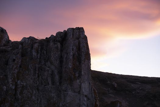 Rock cliff at twilight time with colorful sky background,  landscape photography