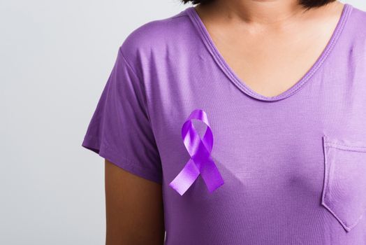 National Epilepsy or Alzheimer disease Day Concept. Young woman stick purple ribbon on the chest symbol of Pancreatic cancer, Epilepsy awareness and world Lupus Day and world cancer isolated white background