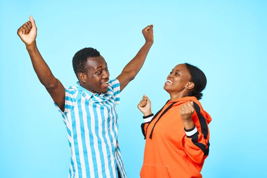 African looking men and women fun blue background