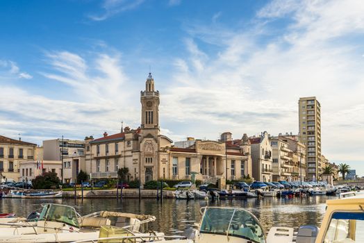 Panoramic view of the Sète canal and the consular palace, in art-deco style, in Hérault in Occitanie, France