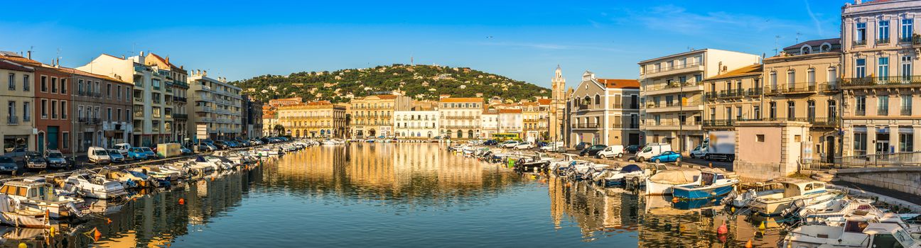 The Peyrade canal and the facades of its houses which are reflected in its water, in Sète in Occitanie.