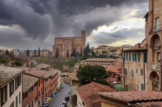 Siena, a city located in Tuscany, in central Italy, is characterized by its medieval brick buildings.