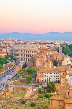 Top view of  Rome city skyline with Colosseum and Roman Forum in Italy.