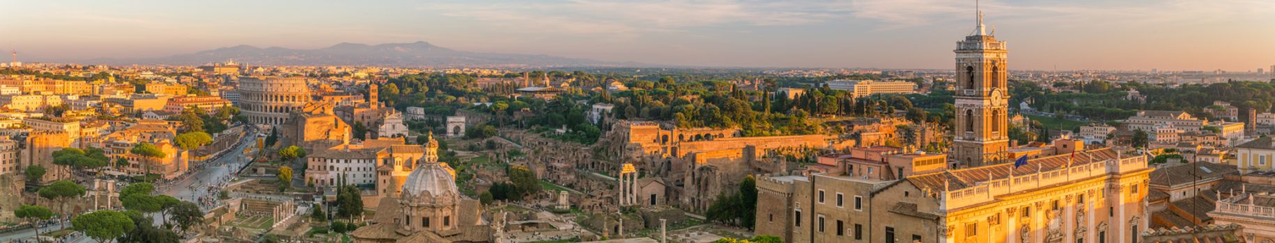Top view of  Rome city skyline with Colosseum and Roman Forum in Italy.