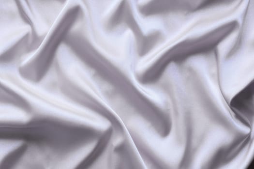 Smooth elegant gray silk with soft folds can be used as background.