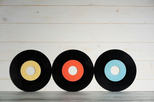 Vinyl records on wooden background,vintage style