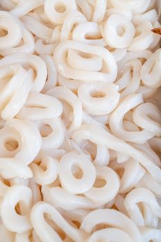 Fresh raw squid rings at seafood market