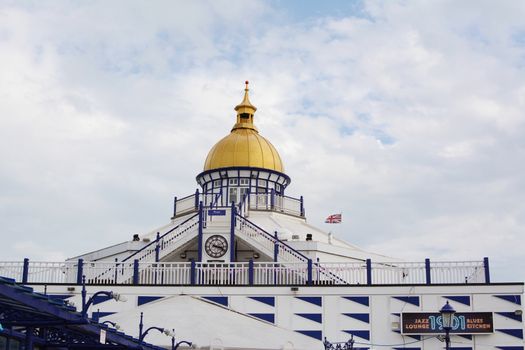 Tower with gold dome at the end of Eastbourne pleasure pier, housing a restored camera obscura