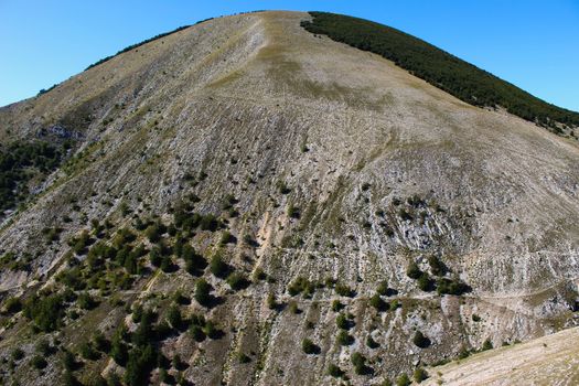 A huge hill above the old Bosnian village of Lukomir, which is quite devoid of vegetation due to soil erosion. Bjelasnica Mountain, Bosnia and Herzegovina.