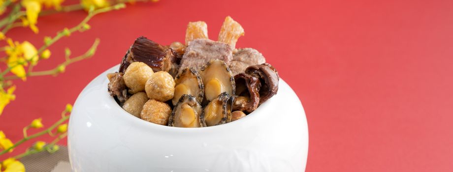 Traditional food of Chinese lunar new year, Buddha jumps over the wall, Chinese Soup Casserole dish, Buddha's Temptation, named Fo Tiao Qiang, close up.