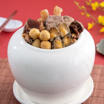 Traditional food of Chinese lunar new year, Buddha jumps over the wall, Chinese Soup Casserole dish, Buddha's Temptation, named Fo Tiao Qiang, close up.