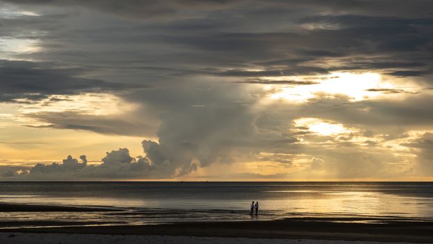 Beautiful sunrise on the beach with cloud sky in the morning.