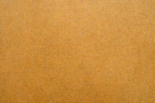 Close up of brown envelope texture on white background.