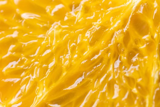 Macro image of ripe orange sliced. Close up fruit background.