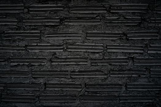 Old black brick wall background. Vintage background.