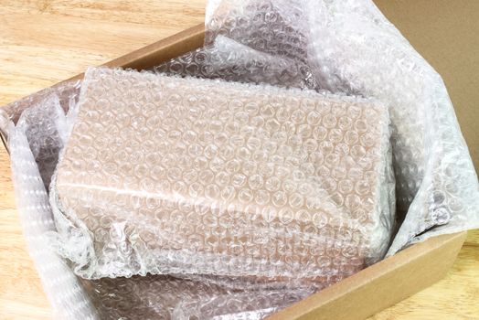 Bubbles covering the box by bubble wrap for protection product cracked  or insurance During transit 