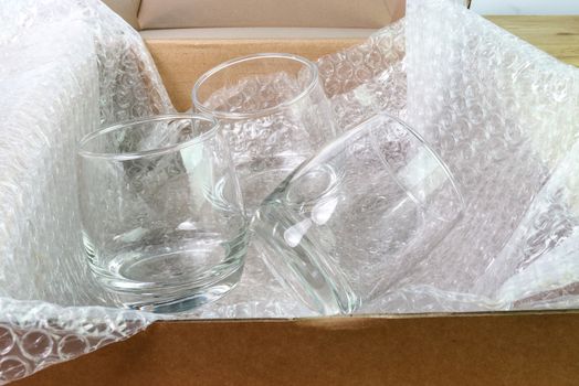 the bubble wrap cover water glass in box for protection product cracked or insurance During transit  
