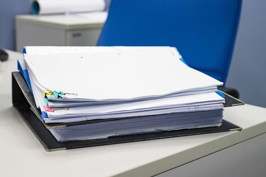 file folder and Stack of business report paper file on the table in a work office, concept document in work office