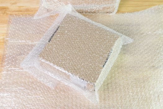 Bubbles covering the box by bubble wrap for protection product cracked  or insurance During transit 