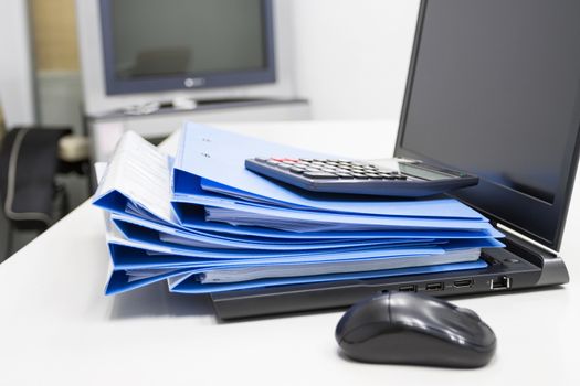 Blue Document folder with Notebook on table at office 