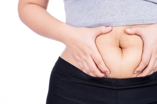 Fat woman holding excessive fat belly, overweight fatty belly isolated on over white background. Diet lifestyle, weight loss, stomach muscle, healthy concept.