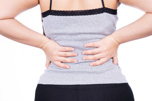 A woman feeling exhausted and suffering from waist and back pain and injury on isolated white background. Health care and medical concept.