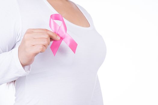 Breast cancer awareness ribbon on woman chest isolated over white background. Medical, healthcare for advertising concept.