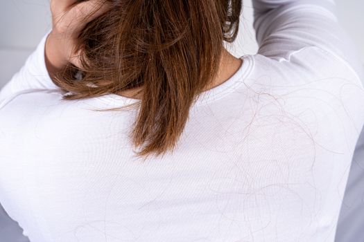Hair fall problem. Back shot covering with hair fall. Healthcare medical or daily life concept.