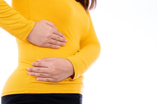 Woman hand touching stomach, waist, or liver position isolated white background. Health care and medical concept.