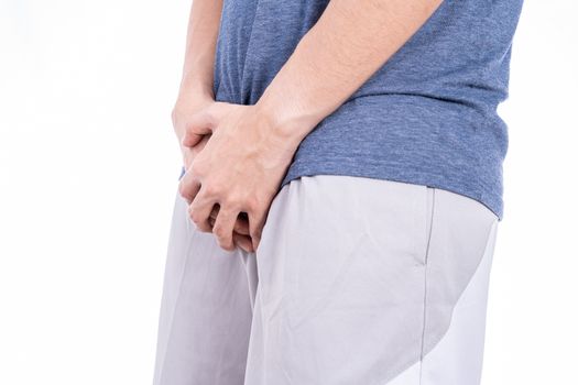 Man hands holding his crotch isolated white background. Medical, healthcare for advertising concept.