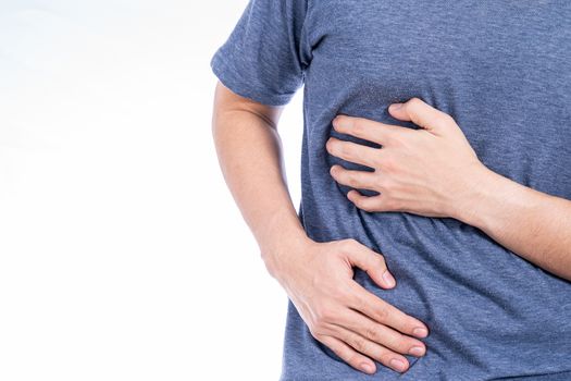 Man hand touching stomach, waist, or liver position isolated white background. Health care and medical concept.