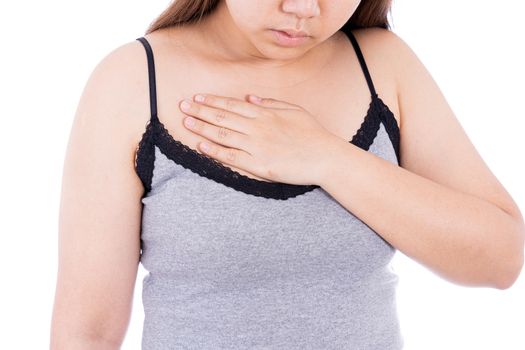 Woman touching her heart or chest isolated white background. Healthcare medical or daily life concept.