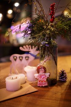 Minimalistic Christmas decor cozy warm room with wooden furniture.