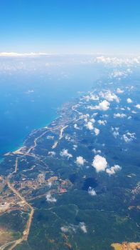 The view from the airplane window to the ground. Landscape view from the sky.