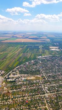 The view from the airplane window to the ground. Landscape view from the sky.