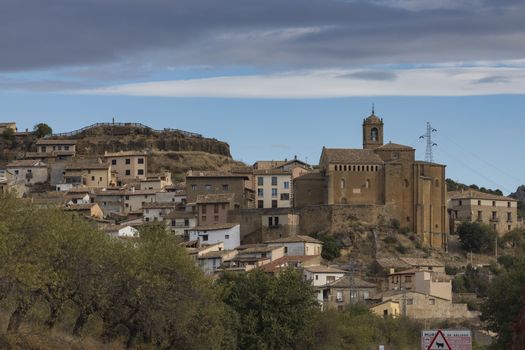 Murillo de Gallego, Spain - October 15, 2020: General view of the town of Murillo de Gallego with its picturesque little houses, and San Salvador church, Huesca, Pre-Pyrenees Aragon.