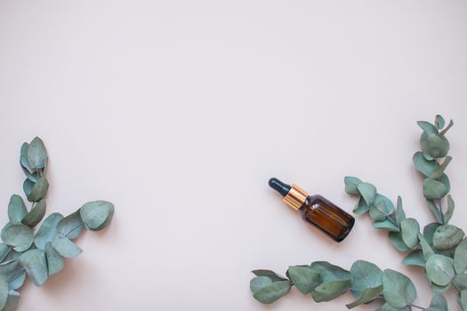 Bottles with face serum on a light background. Beauty industry. Layout