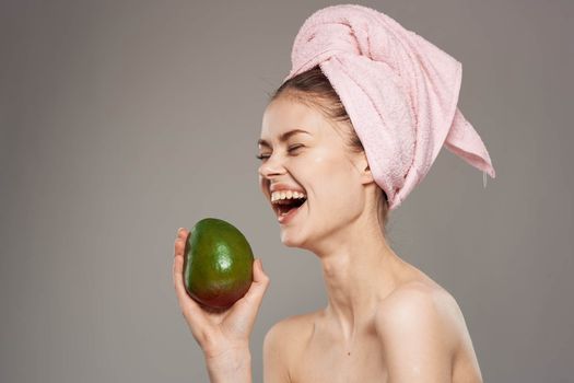 Cheerful woman bare shoulders clean skin cropped view gray background. High quality photo