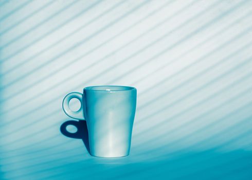 luxury scene with coffee cup on blue nad white background