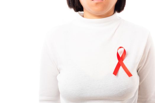 Woman with support HIV AIDS awareness red ribbon on the chest in studio shot isolated on over white background, Healthcare and medicine, World aids day concept