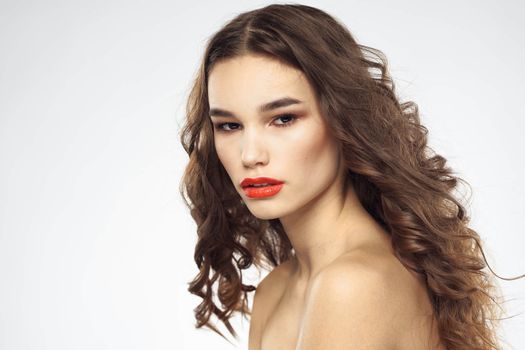 Beautiful woman with drawn swords bright makeup glamor close-up light background. High quality photo