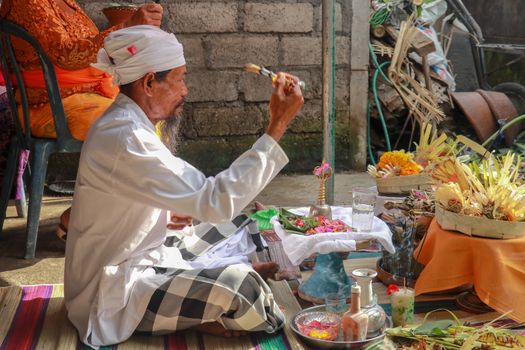 The Hindu Priest or widely known as Pedanda by the Balinese, blessing the ceremony of villas in Nuda dua,Bali.