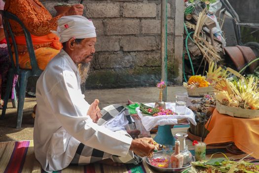 The Hindu Priest or widely known as Pedanda by the Balinese, blessing the ceremony of villas in Nuda dua,Bali.